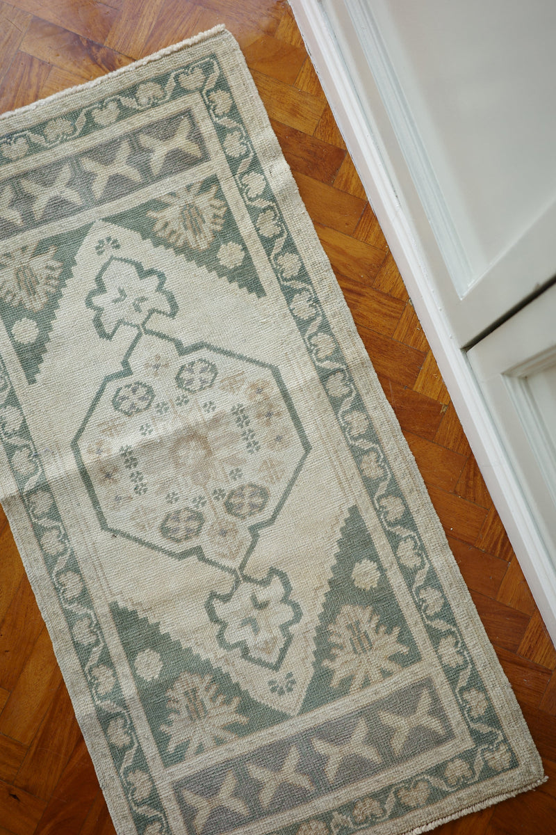 Handwoven Turkish Yastik rug with geometric patterns and rich colors