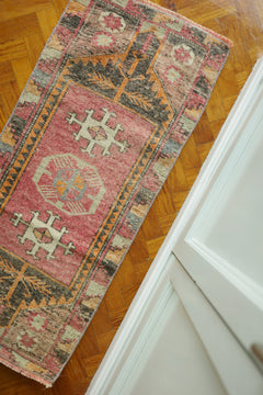Handwoven Turkish Yastik rug with geometric patterns and rich colors