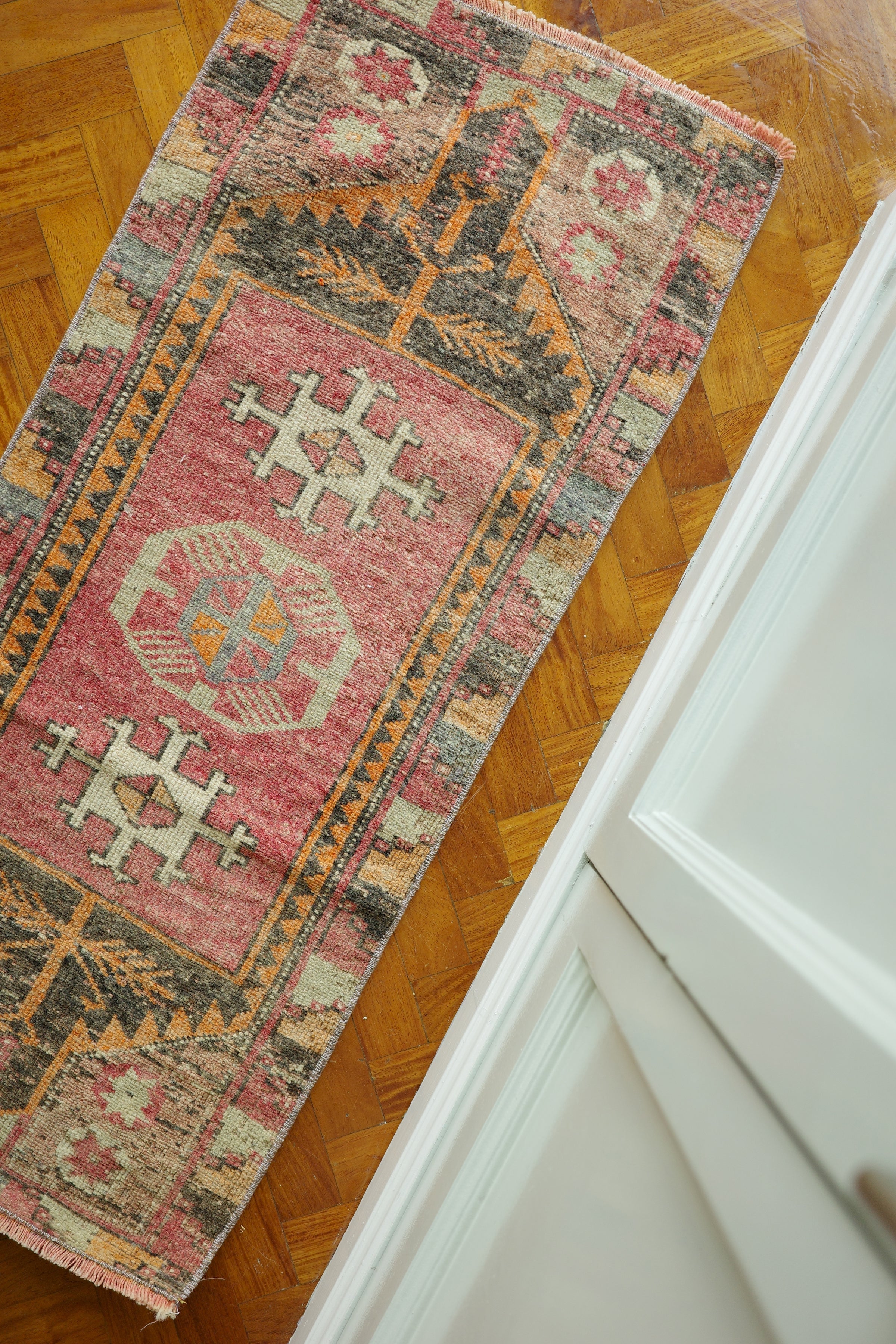 Handwoven Turkish Yastik rug with geometric patterns and rich colors
