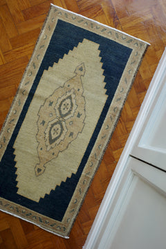 Handwoven Turkish Yastik rug with geometric patterns and rich colors