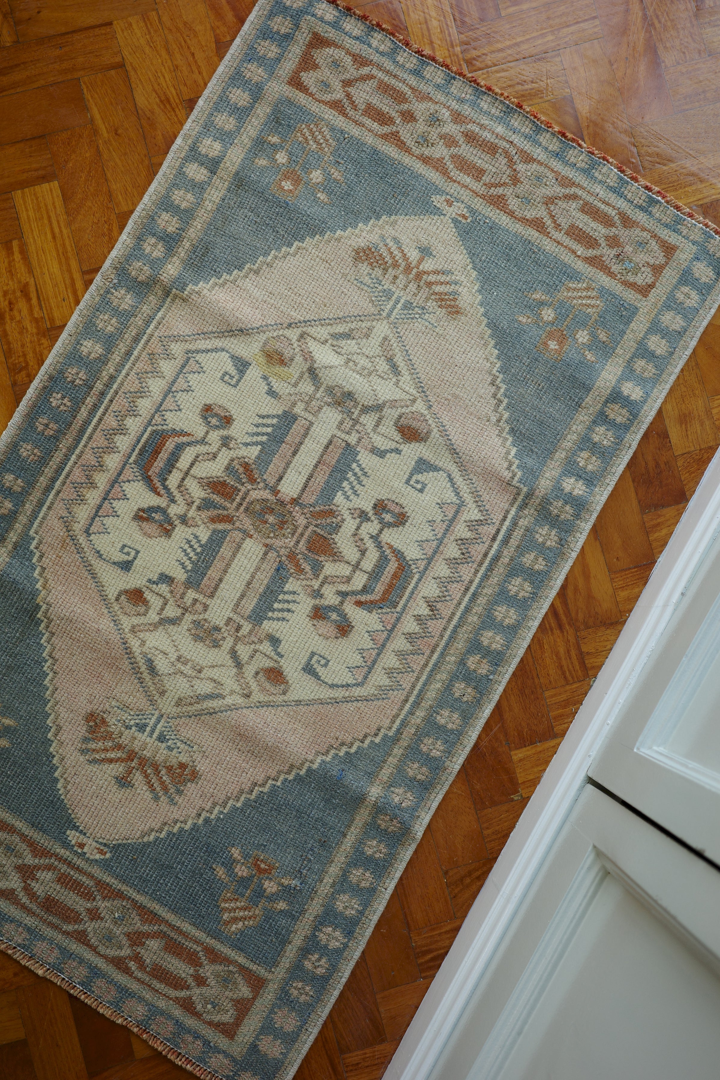 Handwoven Turkish Yastik rug with geometric patterns and rich colors
