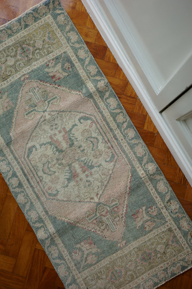 Handwoven Turkish Yastik rug with geometric patterns and rich colors