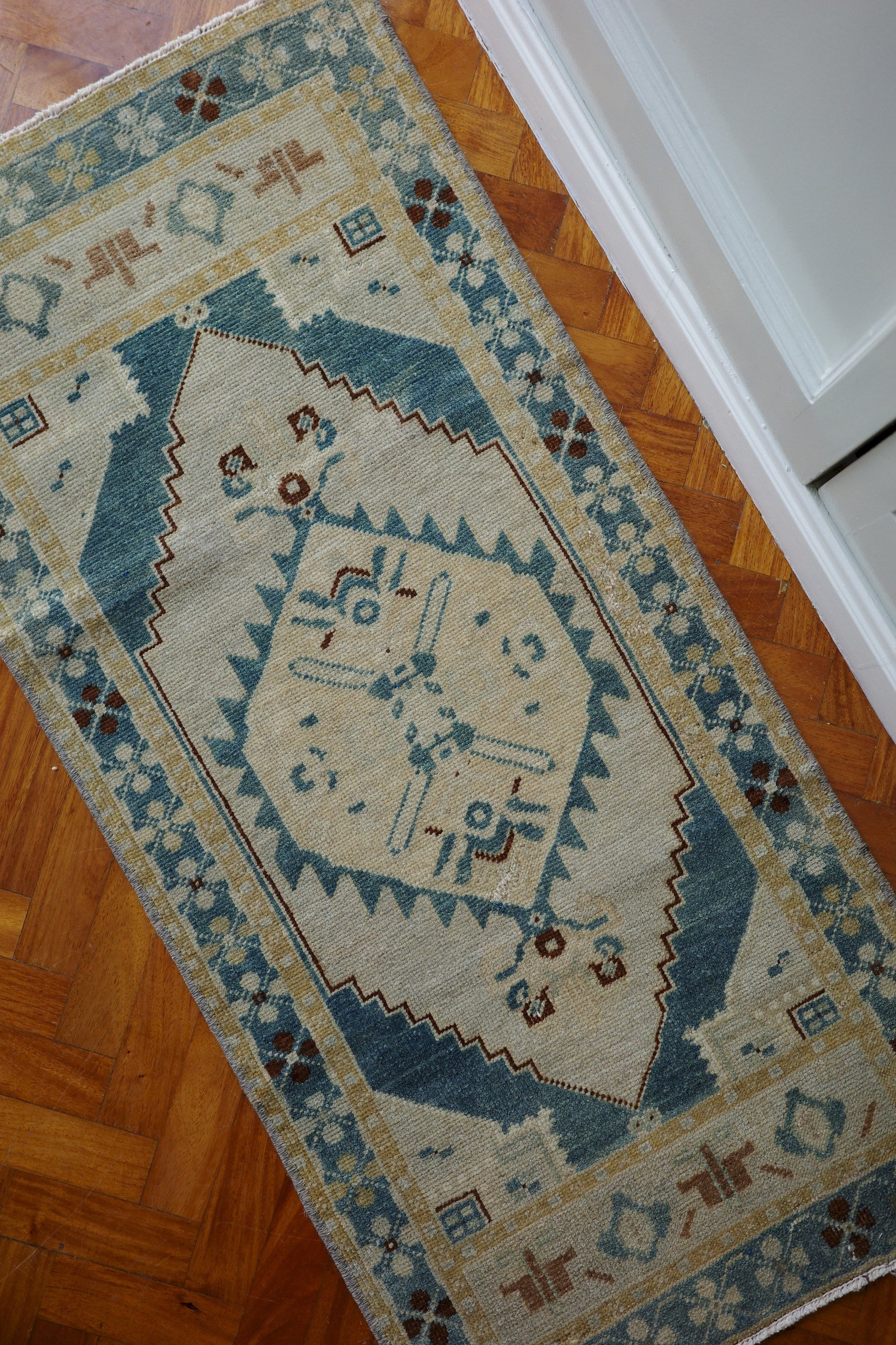 Handwoven Turkish Yastik rug with geometric patterns and rich colors