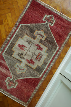 Handwoven Turkish Yastik rug with geometric patterns and rich colors