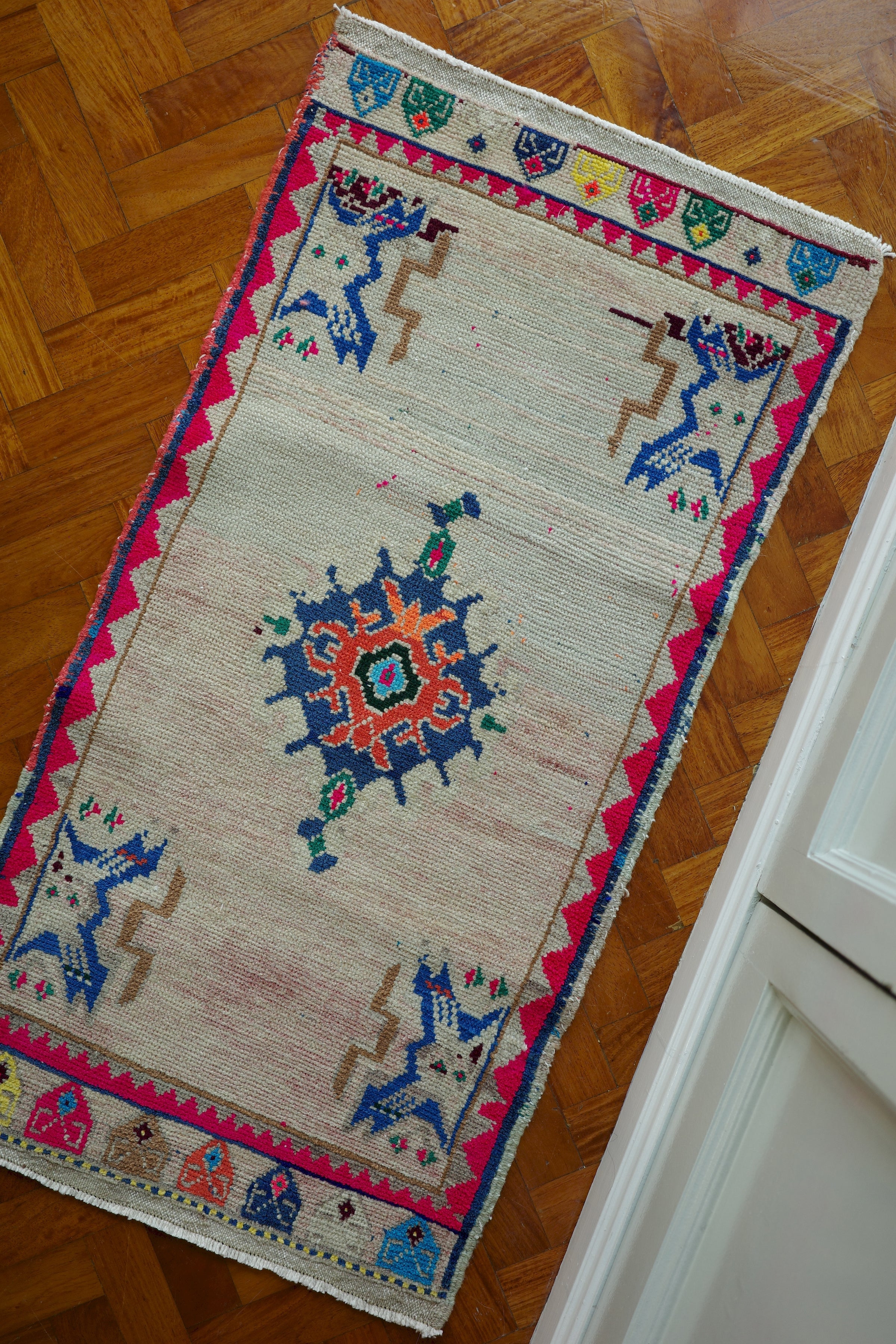 Handwoven Turkish Yastik rug with geometric patterns and rich colors