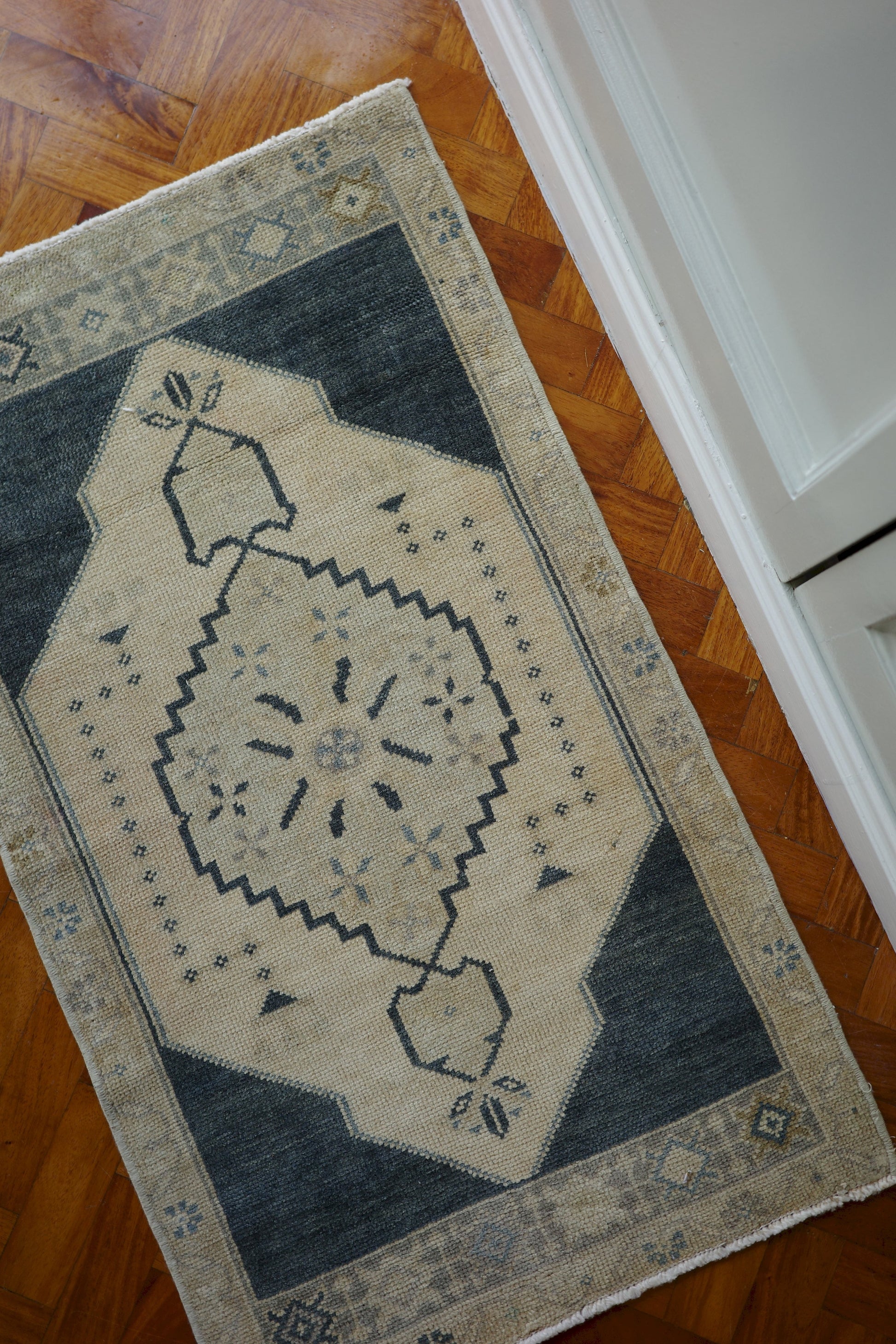 Handwoven Turkish Yastik rug with geometric patterns and rich colors