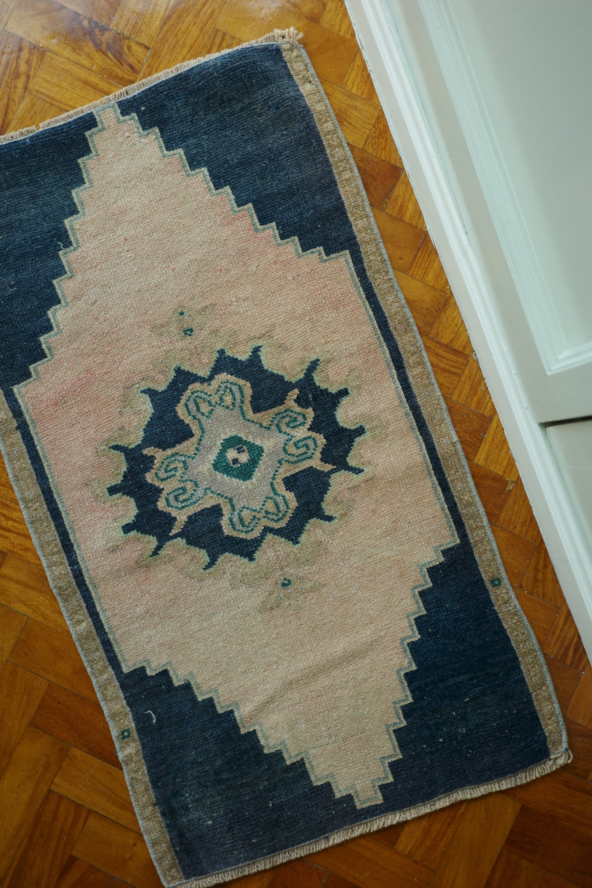 Handwoven Turkish Yastik rug with geometric patterns and rich colors