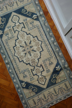 Handwoven Turkish Yastik rug with geometric patterns and rich colors