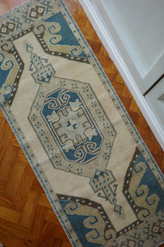 Handwoven Turkish Yastik rug with geometric patterns and rich colors