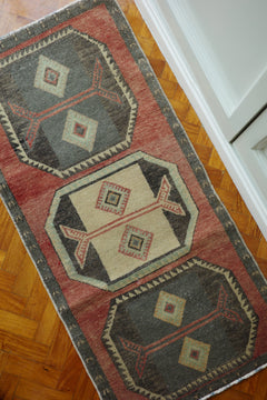 Handwoven Turkish Yastik rug with geometric patterns and rich colors