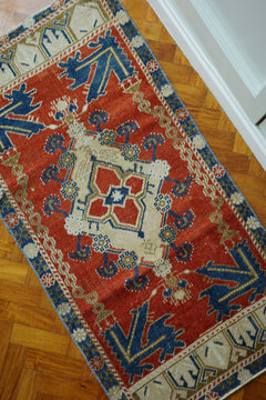 Handwoven Turkish Yastik rug with geometric patterns and rich colors