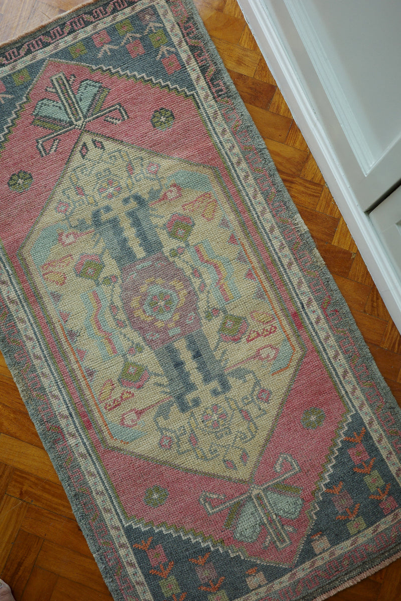 Handwoven Turkish Yastik rug with geometric patterns and rich colors