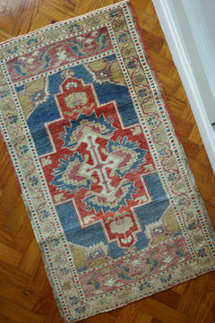 Handwoven Turkish Yastik rug with geometric patterns and rich colors