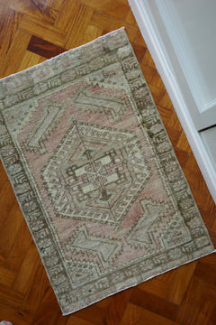 Handwoven Turkish Yastik rug with geometric patterns and rich colors