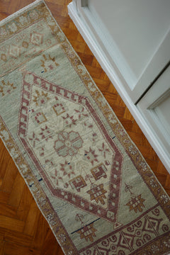 Handwoven Turkish Yastik rug with geometric patterns and rich colors