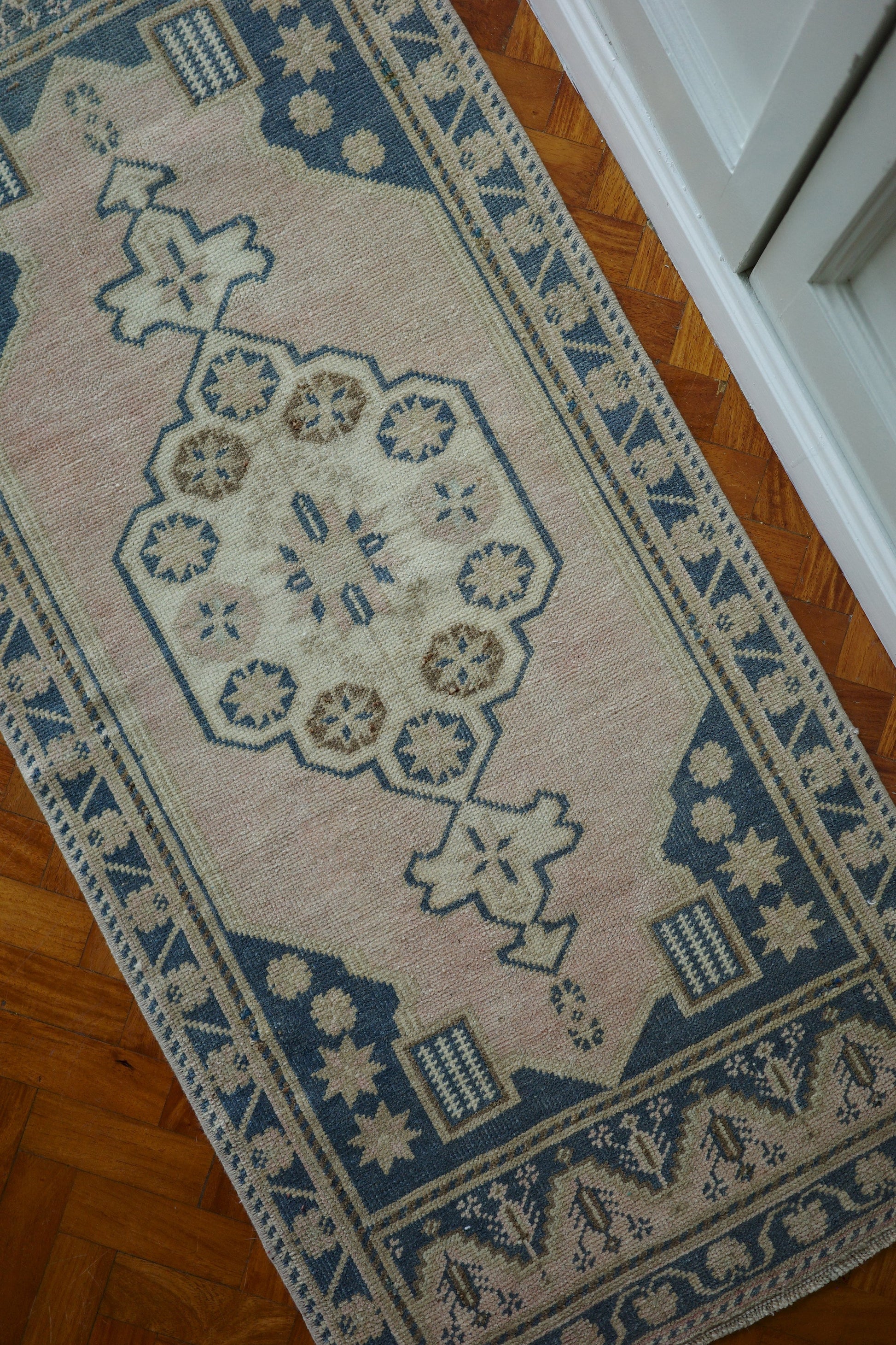 Handwoven Turkish Yastik rug with geometric patterns and rich colors