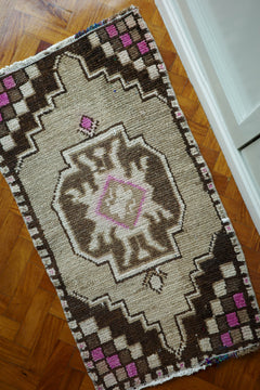 Handwoven Turkish Yastik rug with geometric patterns and rich colors